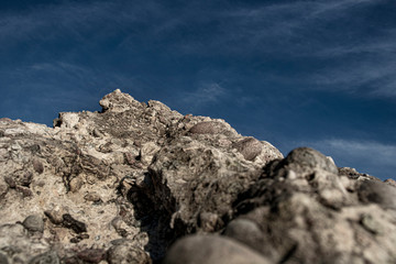 peak of rock and blue sky