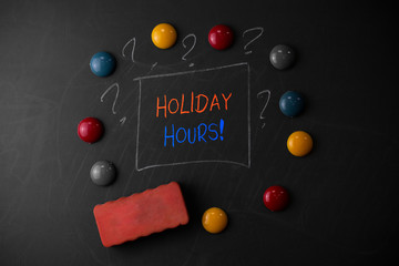 Writing note showing Holiday Hours. Business concept for Overtime work on for employees under flexible work schedules