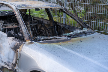burnt down gray passenger car