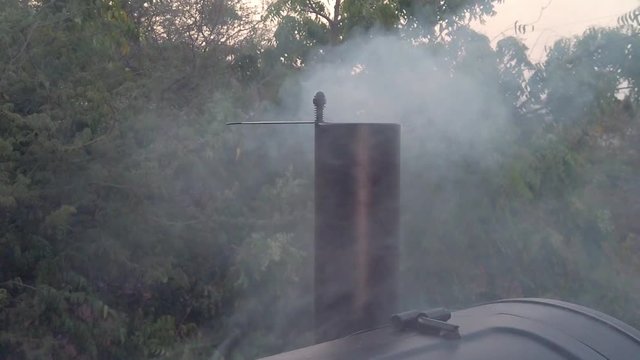Smoke coming out of the BBQ pit. Imagine how delicous the foos will be. This summer we will for sure have Barbeque muliple times.