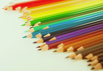 colored pencils lying in irregular row