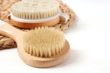 Brush for dry massage on a light background.