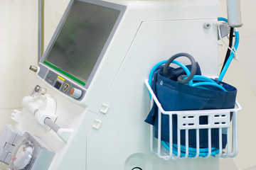 Close up digital vital signs of measuring heart and blood pressure monitor with elderly patient sleep on the bed in hospital room.