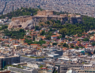 Fototapeta premium Greece, Athens aerial view with parthenon temple on acropolis hill and Plaka old neighborhood