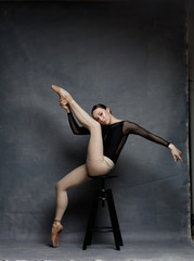 Fototapeta na wymiar one ballerina dancing on a retro background