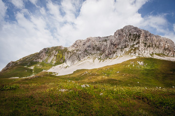 sunny bkue sky and white clouds in the mountains landscape. Beautiful summer Mountain landscape view.  the northern part of Abkhazia,  the Caucasus Mountains. Arabica Mountains