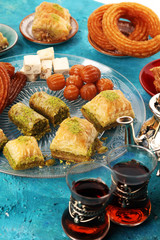 Middle eastern or arabic dishes. Turkish Dessert Baklava with pistachio on dishes