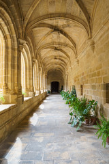 Fototapeta na wymiar Corridor of cloister of the Santo Domingo convent in Plasencia, Spain. This building is nowadays the Parador Hotel of Plasencia.