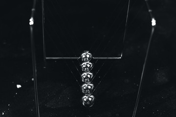 Newton cradle pendulums kinetic balls