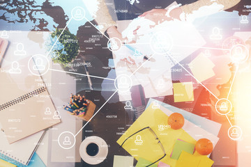 Fototapeta premium Social network theme hologram over hands taking notes background. Concept of global international people connect. Double exposure