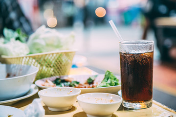 Black soft drink glass On the dinner table