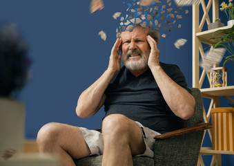 Drown image of losing of mind. Old bearded man with alzheimer desease sitting and suffering from...