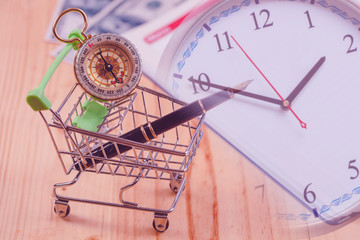 Time for online business concept fountain pen in shopping cart.