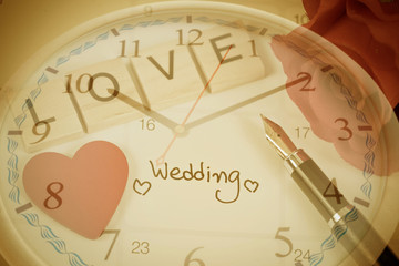 Reminder Wedding day in calendar planning time and love letter on wood with color tone.