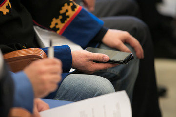 office people working on mobile phones