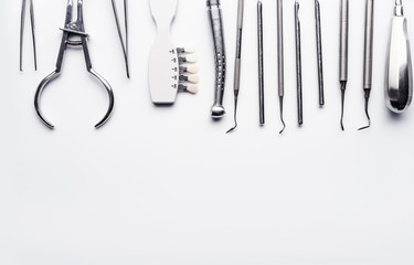 Different dental equipment with copy space on white background