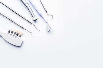 dental tools on white background with copy space