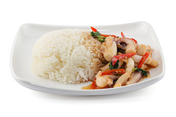 rice topped with stir-fried squid and basil isolated on white background