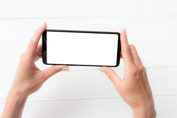 Template of modern black smartphone holded in hands for your design