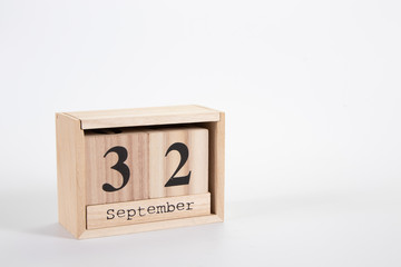 Wooden calendar September 32 on a white background