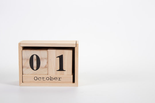 Wooden calendar October 01 on a white background