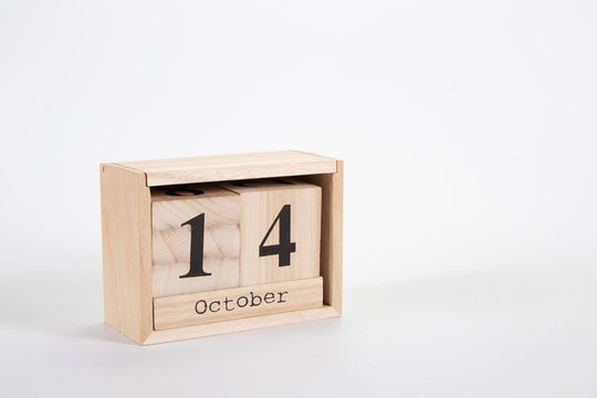 Wooden calendar October 14 on a white background