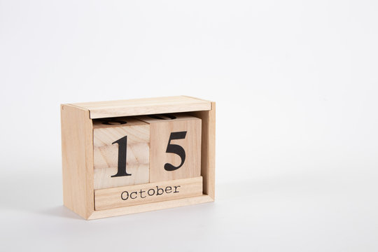 Wooden calendar October 15 on a white background