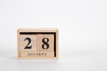 Wooden calendar October 28 on a white background