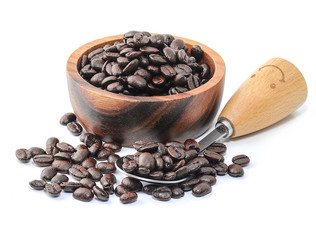 Coffee Beans in wooden bowl and wooden iron spoon isolated on white background