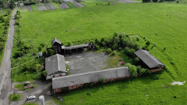 thrown hangars, with an old metal tower water reservoirs aerial background nature wallpapper