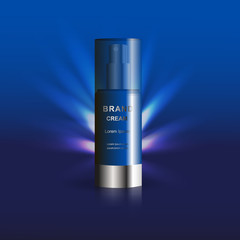 Bottle of night face cream on blue background. Template for advertising your product.