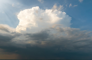 The looming storm front consisting of cumulus clouds.