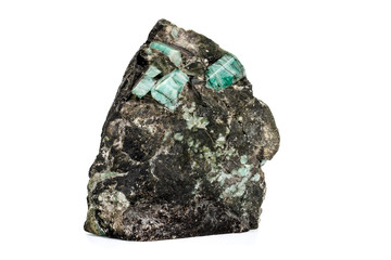 Macro emerald stone mineral in rock on white background