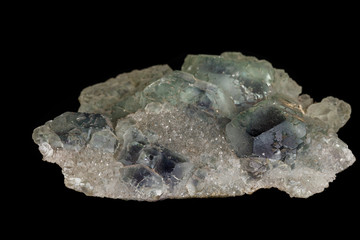 macro mineral fluorite stone on black background