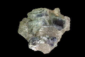 macro mineral fluorite stone on black background