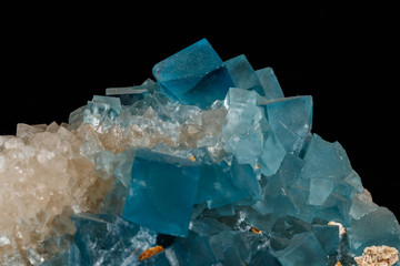 macro mineral fluorite stone on black background