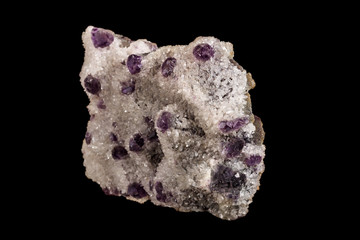 macro mineral fluorite stone on black background