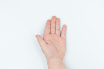 This is a capture for a child hand on a white background in a studio light 