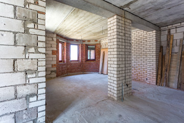 empty interior in house without repair with white silicate brick walls