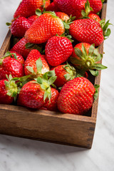 Wooden box with market fresh strawberries