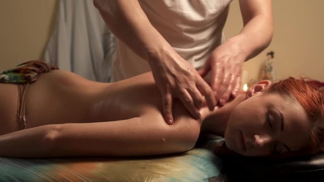 Body care. Spa body massage treatment. Woman having massage in spa salon