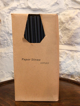 A box of environmental friendly paper straws in a plain no branding box which are replacing plastic straws, nobody in this image