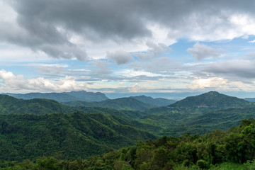 Naklejka premium Blue sky high peak mountains fog hills mist scenery national park views at Phu Tub Berk, Khao Koh, Phetchabun Province, Thailand