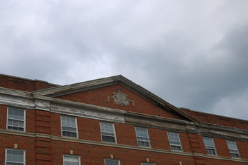 Fototapeta na wymiar Rooftop of historic b brick ornate architecture building
