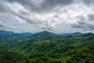 Blue sky high peak mountains fog hills mist scenery national park views at Phu Tub Berk, Khao Koh, Phetchabun Province, Thailand
