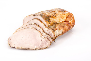 Pork loin roasted in herbs. Cold meat on a white background.