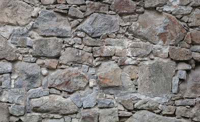medieval texture of field stones of a fortress wall