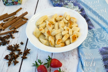 Noodles with cheese and fruit, tasty dinner.