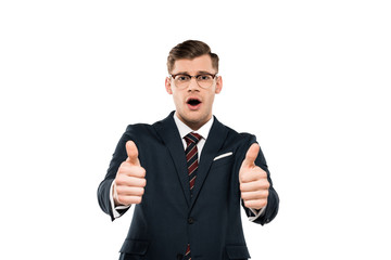 surprised businessman in glasses showing thumbs up isolated on white