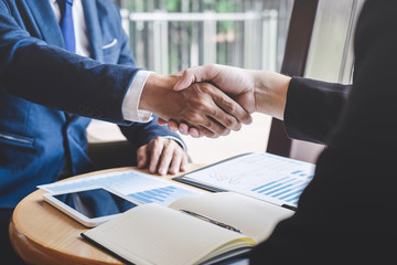 Handshake of two business people after contract agreement become a partner - obrazy, fototapety, plakaty